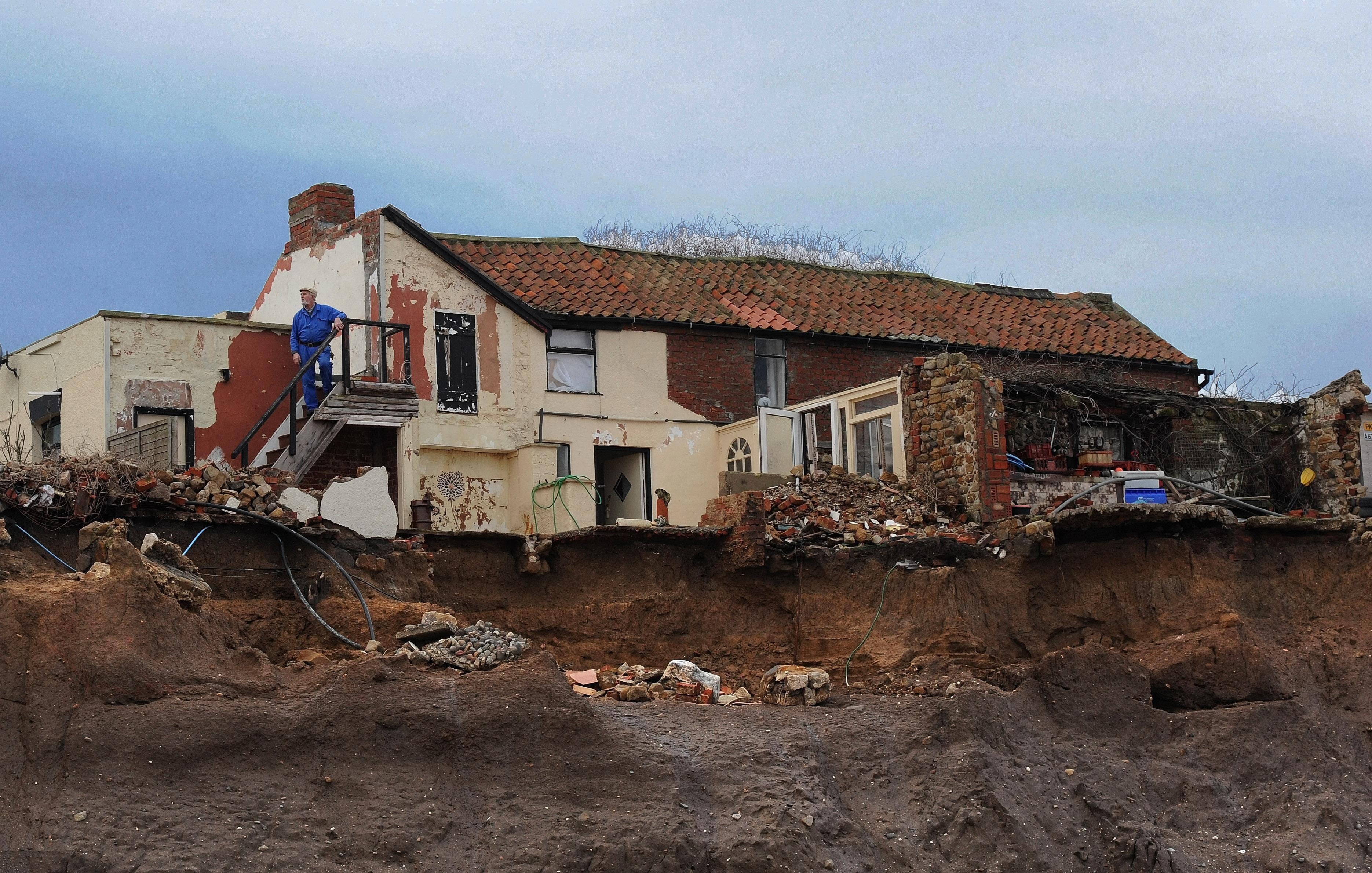 A house near Skipsea teeters over the edge in 2007