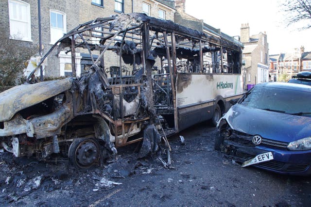 The burnt-out remains of a 30-seater bus that was damaged by fire in Hackney, east London (Eleanor Cunningham/PA)