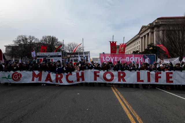 <p>Anti-abortion activists march during the 49th annual March for Life rally on the National Mall on January 21, 2022 in Washington, DC. The rally draws activists from around the country who are calling on the U.S. Supreme Court to overturn the Roe v. Wade decision that legalized abortion nationwide. </p>