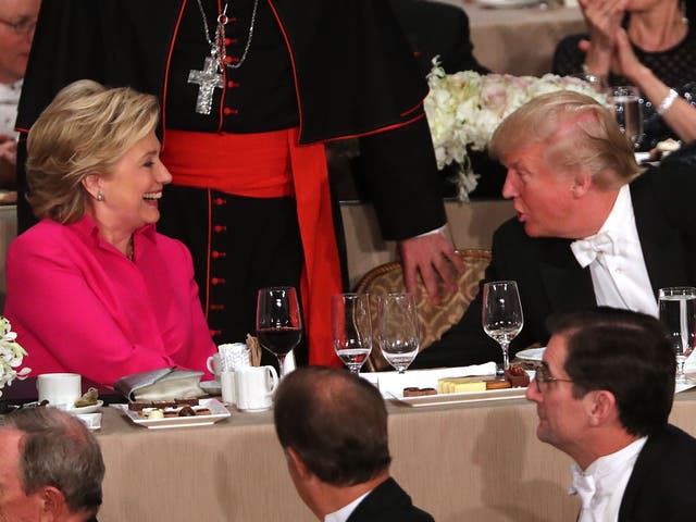 <p>Hillary Clinton speaks briefly with Donald Trump while attending the annual Alfred E. Smith Memorial Foundation Dinner at the Waldorf Astoria on October 20, 2016 in New York City.</p>
