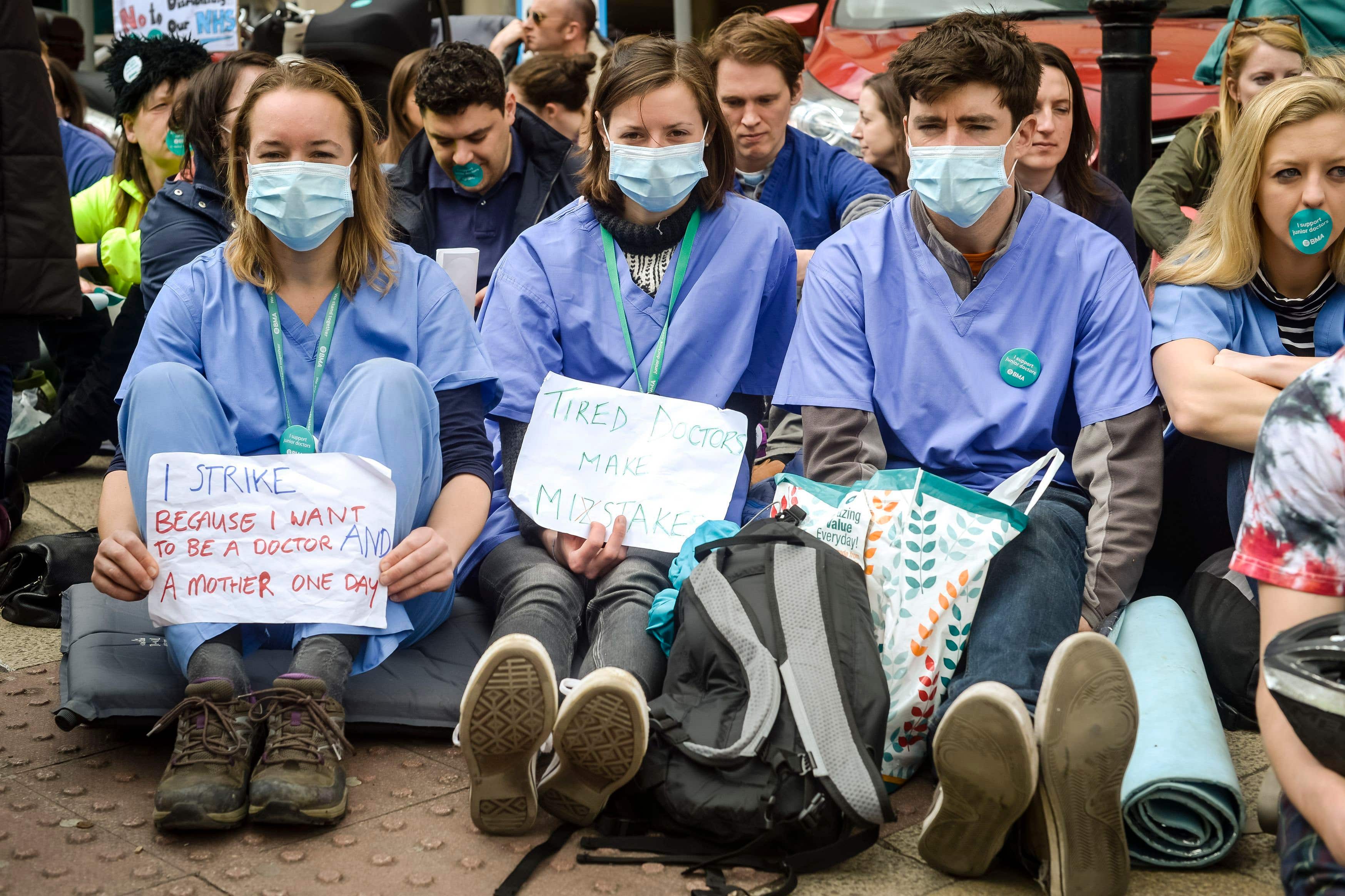 Junior doctors in a silent protest outside Bristol Royal Infirmary (PA)