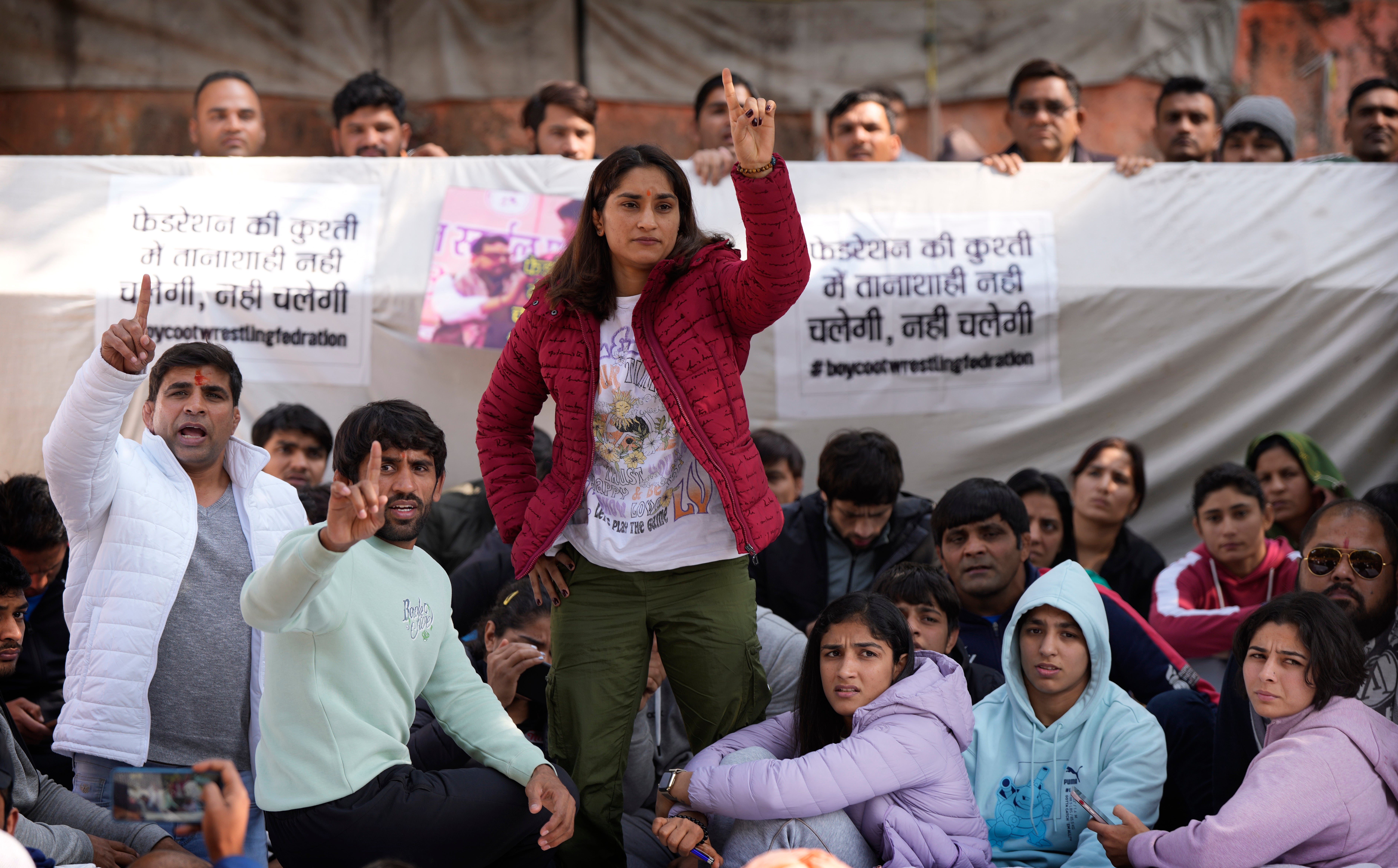 Bajrang Punia, Indian wrestler who won a Bronze medal at the 2020 Tokyo Olympics, second left, participates with other wrestlers in the protest