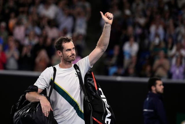 Andy Murray gives a thumbs up as he departs Margaret Court Arena (Ng Han Guan/AP)