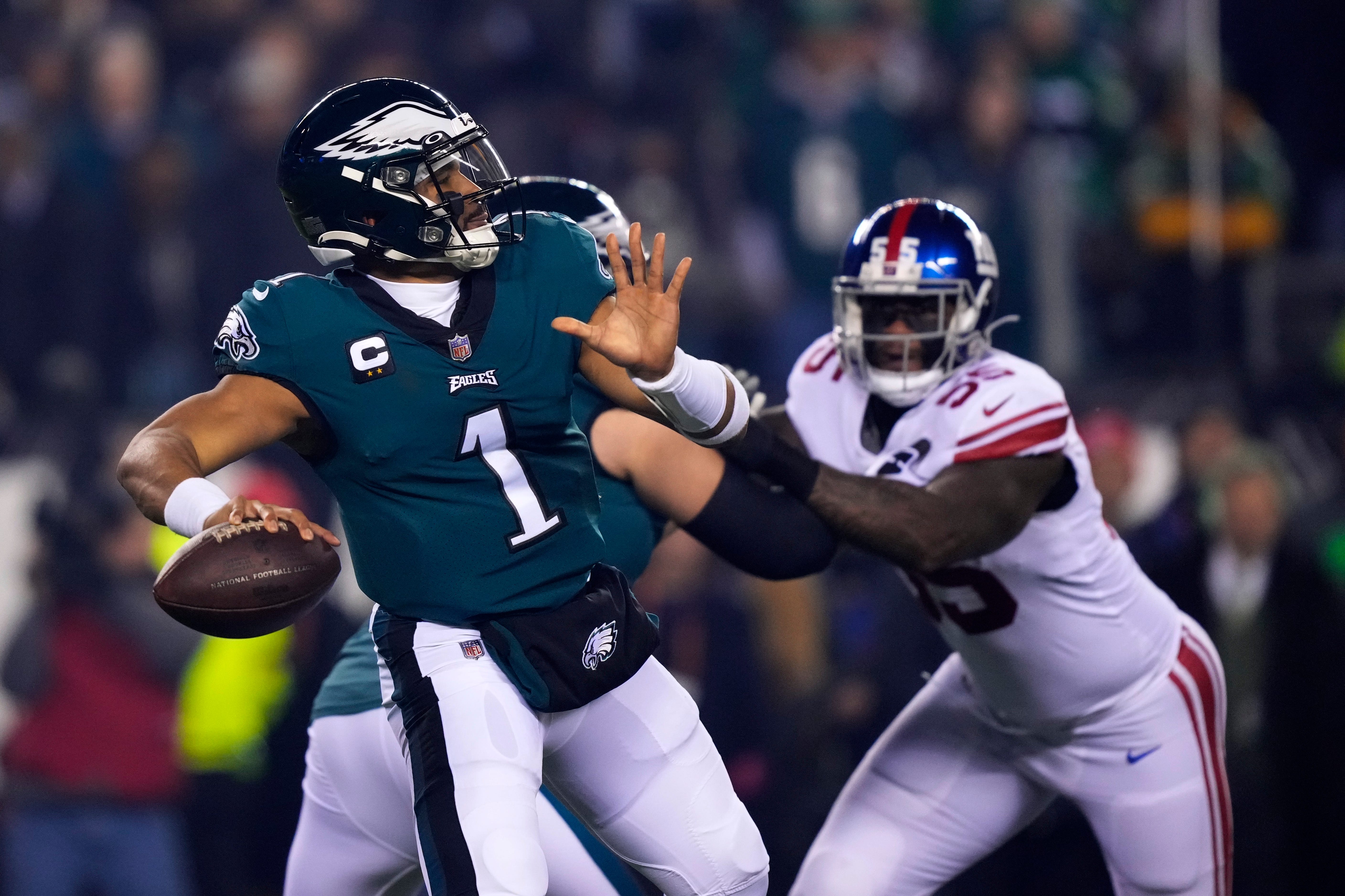 Jalen Hurts, left, shook off his injury worries as he led the Philadelphia Eagles to the NFC Championship game with three touchdowns in a 38-7 humbling of the New York Giants (Matt Rourke/AP)