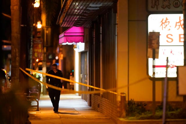 <p>A police officer walks near a scene where a shooting took place in Monterey Park, California </p>