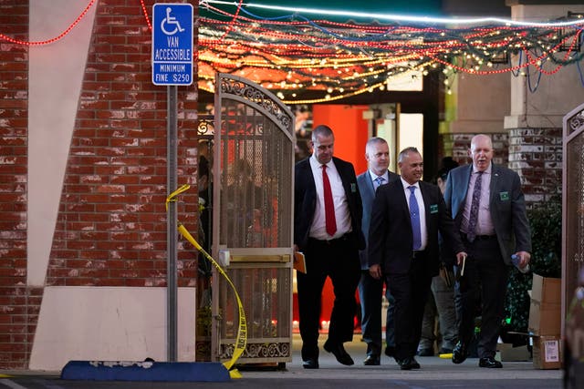 <p>Investigators leave the Star Ballroom Dance Studio following Saturday's fatal mass shooting in Monterey Park on 22 January 2023</p>