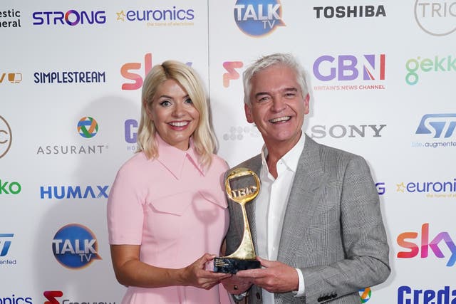 Holly Willoughby and Phillip Schofield have shared snaps of them with their pants on their head (Ian West/PA)