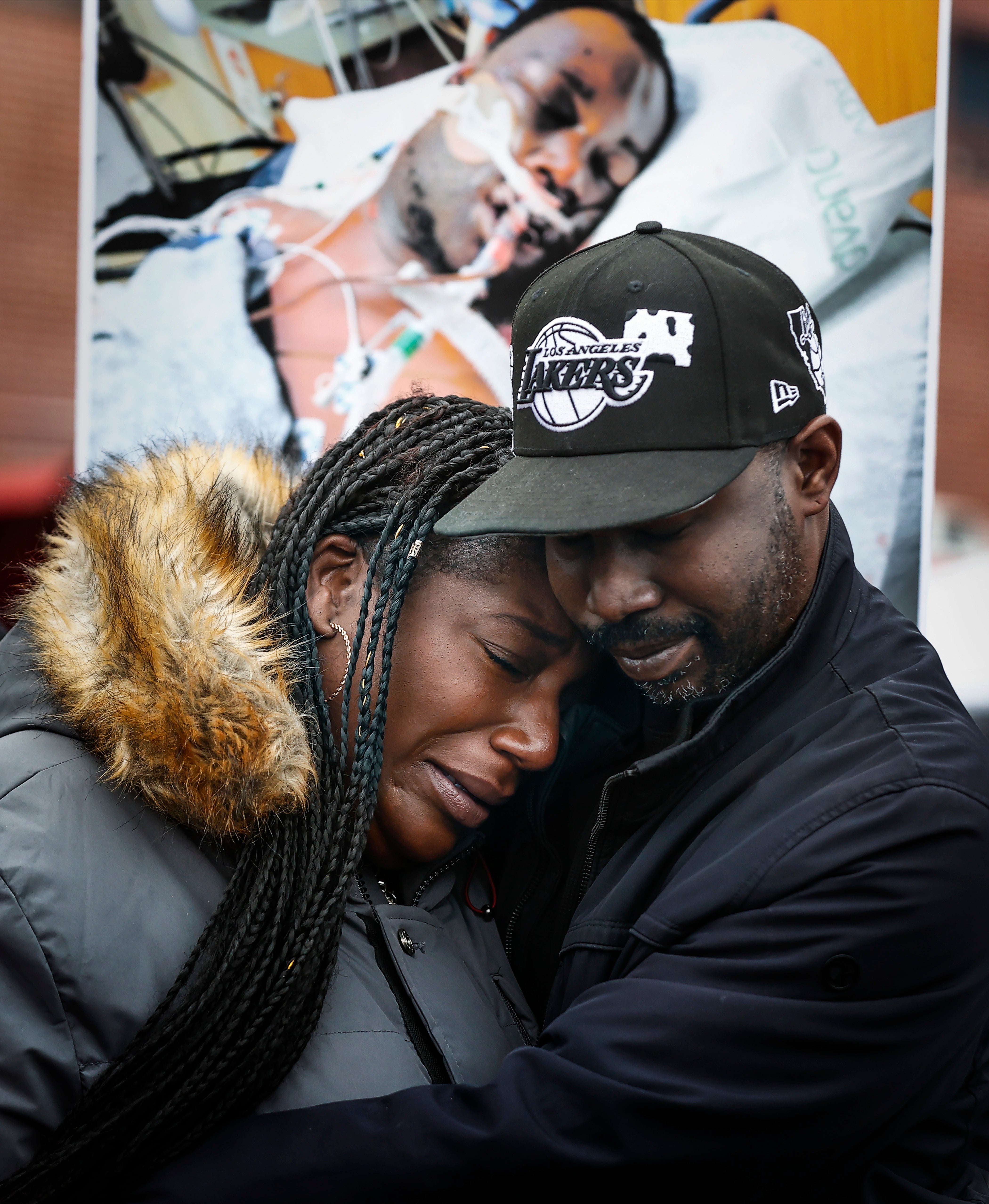 Kenyana Dixon is comforted during a rally for her brother Tyre Nichols at the National Civil Rights Museum on Jan. 16, 2023