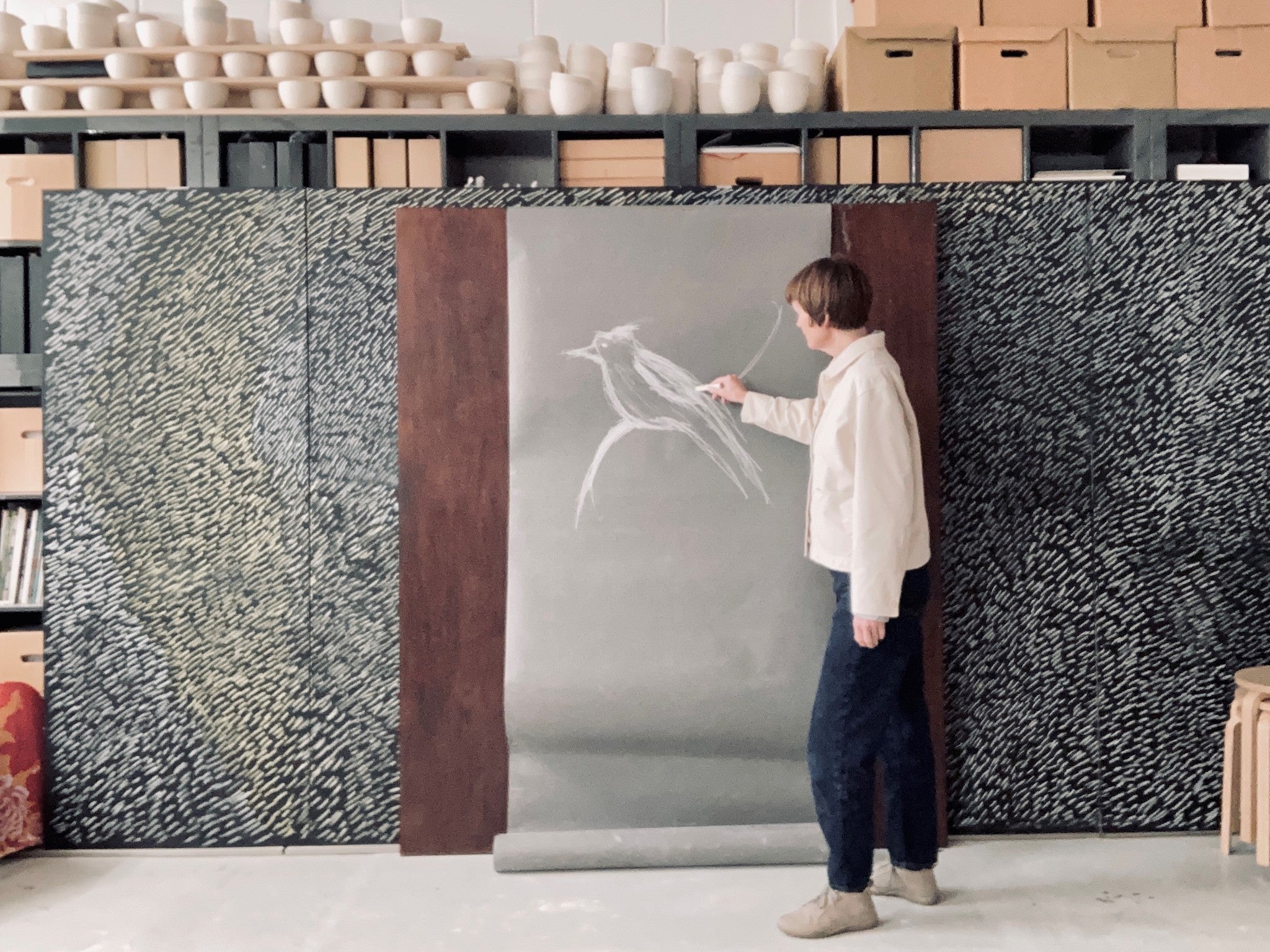Clare Twomey in her studio, drawing for The Wild Escape