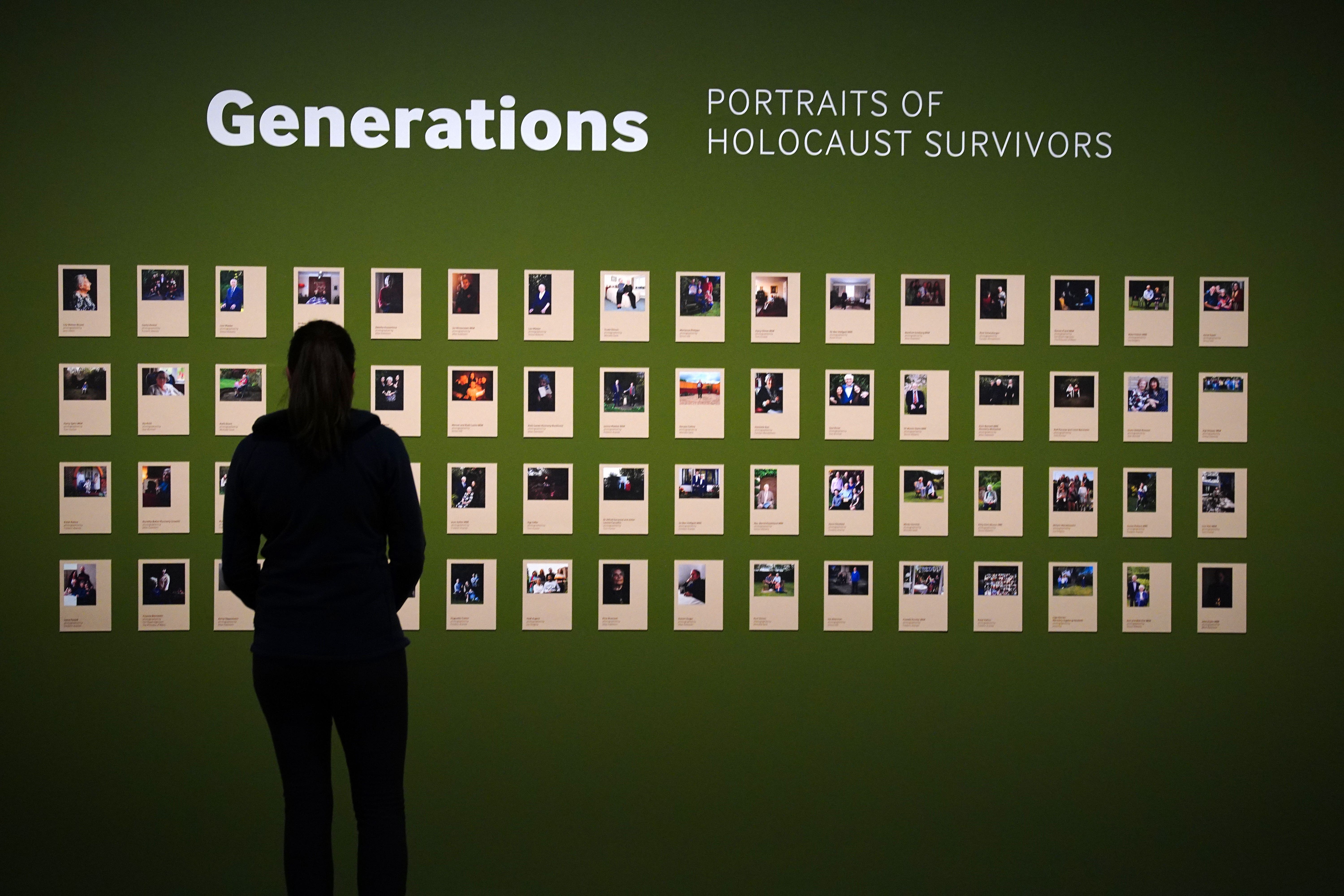 A person looks at the Generations portraits exhibited for the first time at IWM North in Manchester for Holocaust Memorial Day (Peter Byrne/PA)