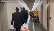 George Santos ‘surprises’ journalists waiting outside his office with Dunkin’ Donuts