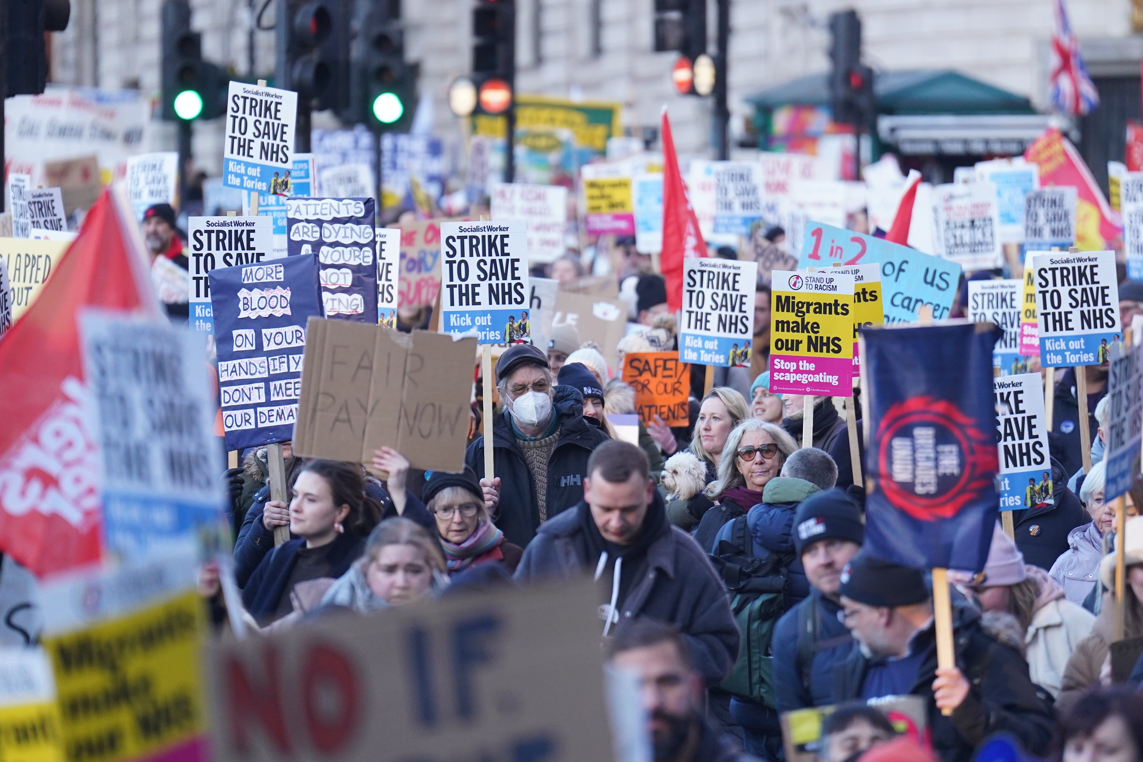 Protesters march through Trafalgar Square during the nurses strike. (James Manning/PA)