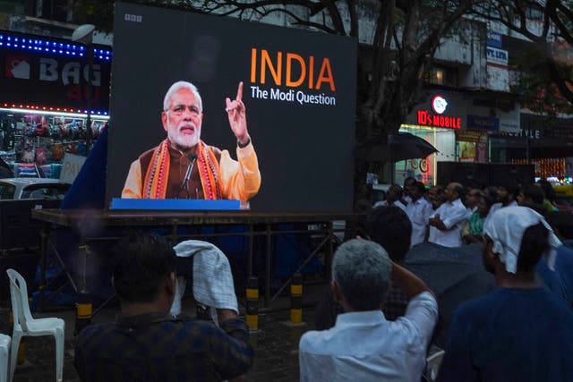 <p>People watch the BBC documentary ‘India: The Modi Question’, on a screen installed at the Marine Drive junction under the direction of the district Congress committee, in Kochi </p>