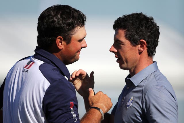 <p>Rory McIlroy (right) has had his say on an incident with Patrick Reed (left) in Dubai</p>