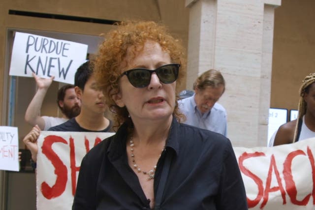 <p>Nan Goldin attending a protest against Purdue Pharma and the Sackler family, as seen in ‘All the Beauty and the Bloodshed’ </p>