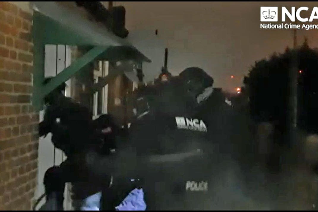 A raid on one of several addresses in London by the NCA (National Crime Agency/PA)