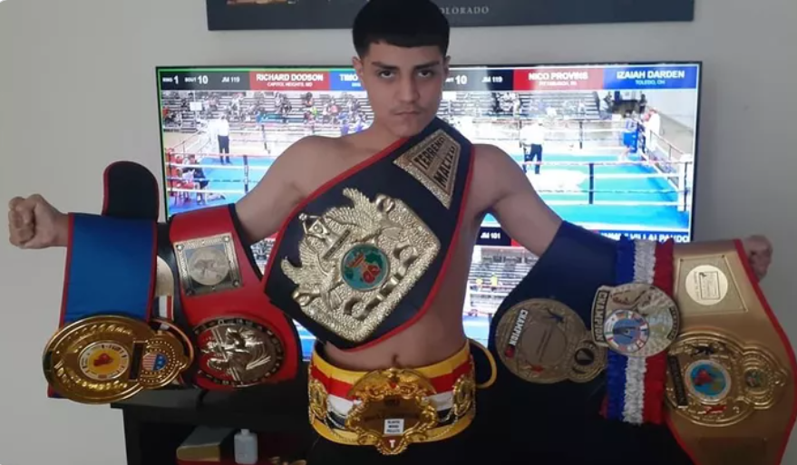 Donovan Garcia poses with his array of boxing belts