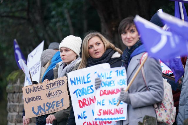 Members of the Chartered Society of Physiotherapy on the picket line outside Nottingham’s Queen’s Medical Centre as they go on strike for the first time over pay (Joe Giddens/PA)