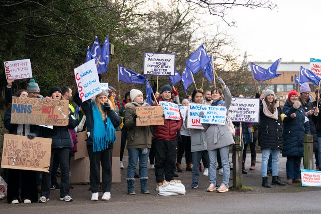 Members of the Chartered Society of Physiotherapy on the picket line outside Nottingham’s Queen’s Medical Centre in Nottingham (Joe Giddens/PA)