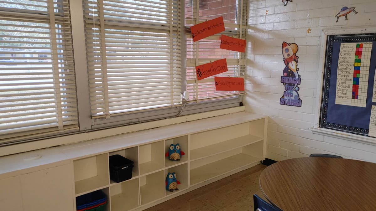 ‘I’ve never seen anything like it’: Florida teachers strip classroom shelves of books in response to DeSantis ban