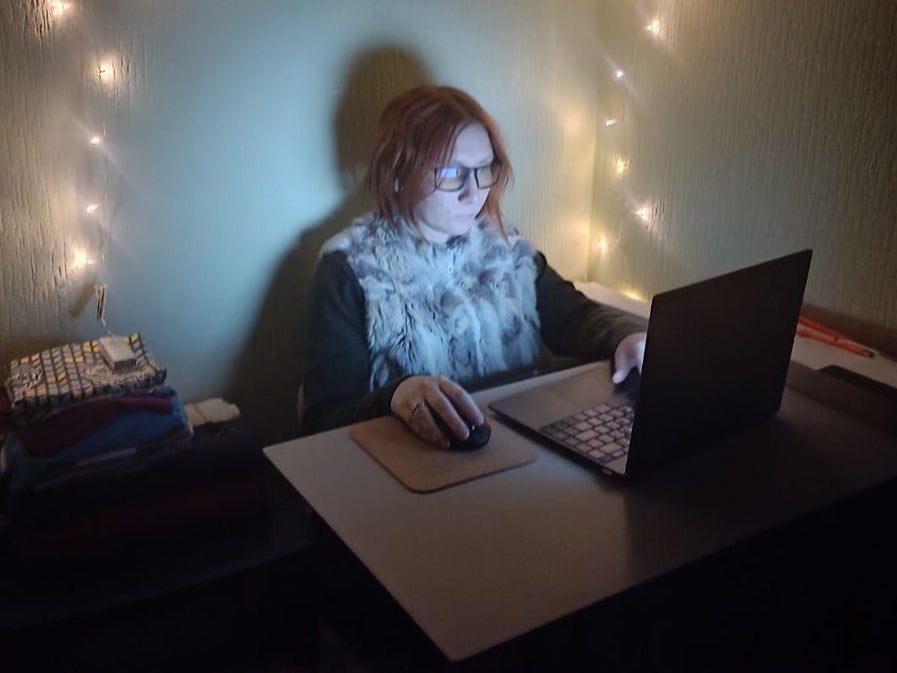 Anastasia looks like any other web designer - but works under fairy lights in an improvised shelter