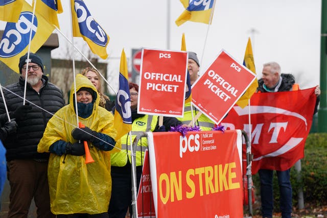Members of the Public and Commercial Services (PCS) union on the picket line (Jacob King/PA)