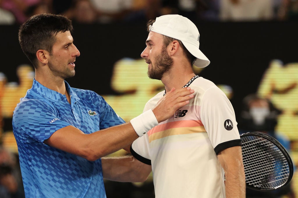 Djokovic greets Paul at the net