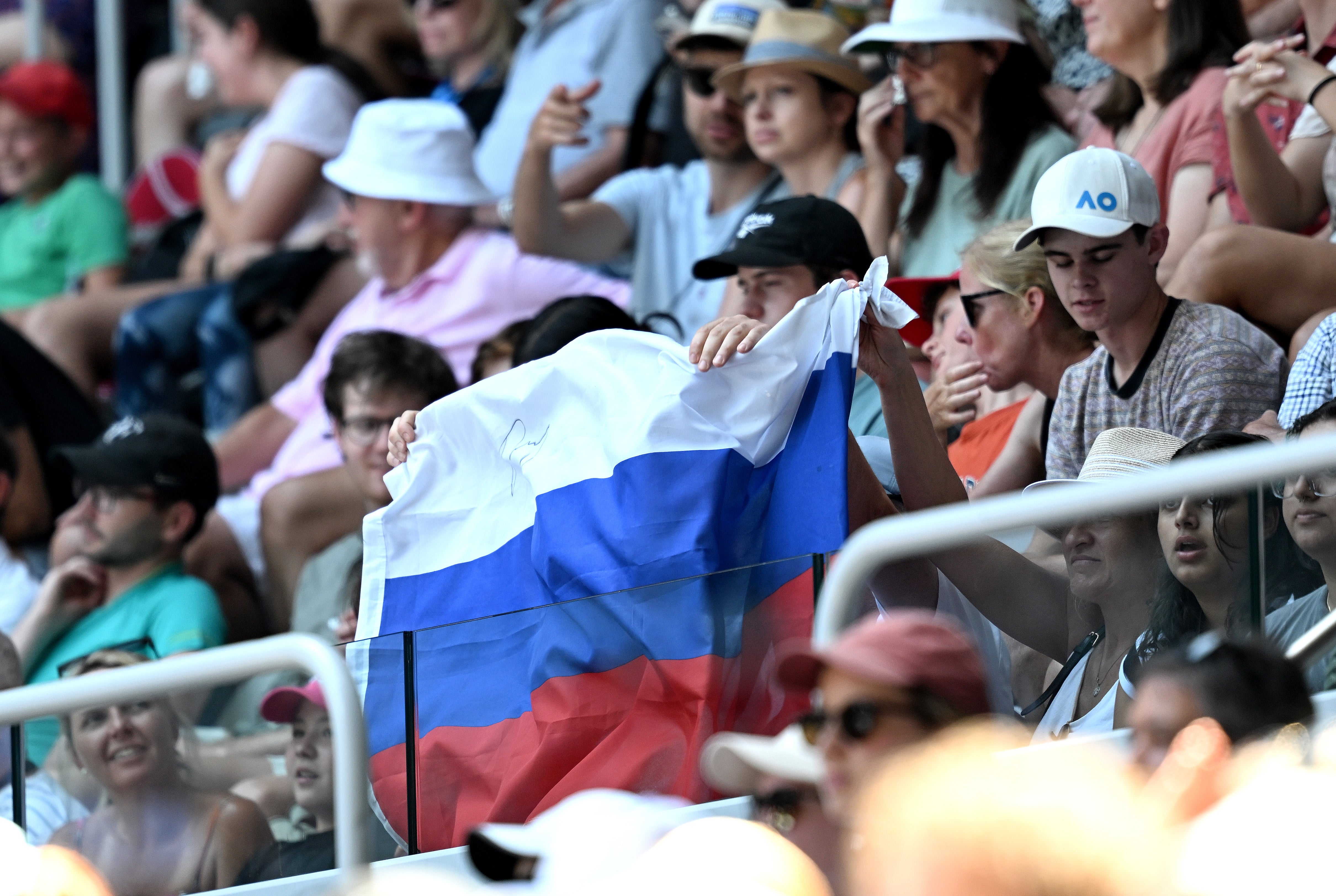 A Russian flag is displayed by spectators at the Australian Open
