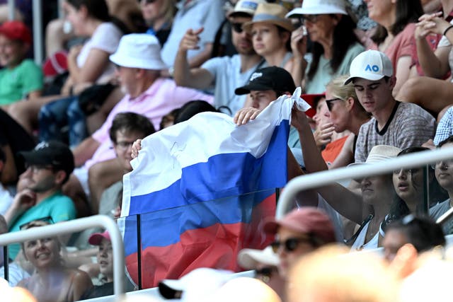 <p>A Russian flag is displayed by spectators at the Australian Open</p>