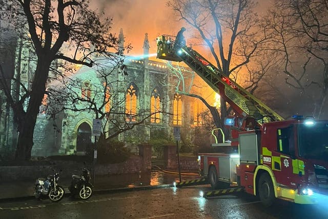 Firefighters tackle the blaze at St Mark’s Church (London Fire Brigade/PA)