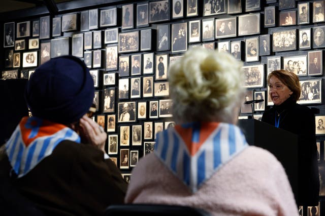 <p>Holocaust survivor Eva Umlauf with others at a ceremony in the former Nazi camp Auschwitz on Friday</p>
