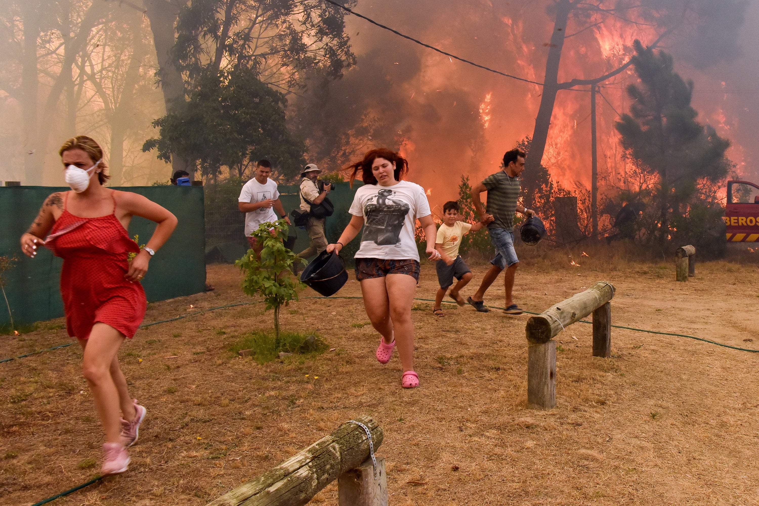 People run from flames during fire in La Floresta, Uruguay
