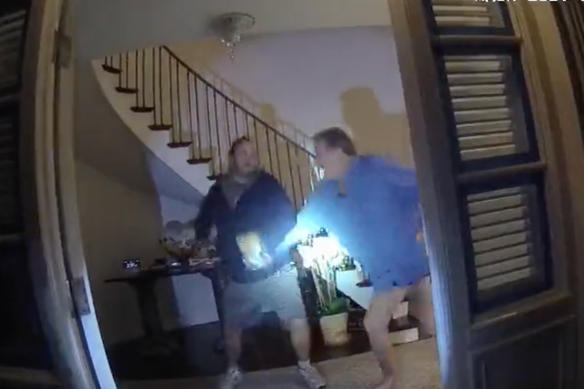 <p>A screen grab from police bodycam footage shows Paul Pelosi and an intruder identified as David DePape </p>