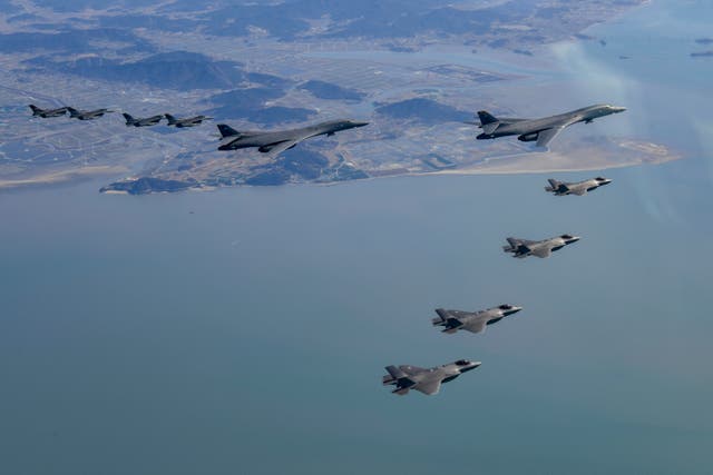 <p>Two US B-1B Lancer strategic bombers, four US Air Force F-16 fighter jets and four South Korean Air Force F-35 fighter jets fly over South Korea during the joint air drills in November 2022 </p>