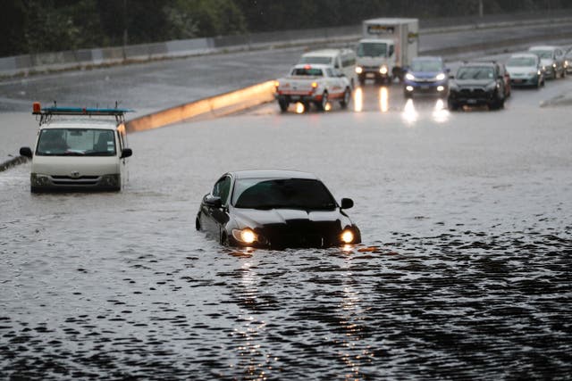 <p>Vehicles are stranded by flood water in Auckland on 28 January a day after record levels of rainfall pounded New Zealand’s largest city, causing widespread disruption</p>