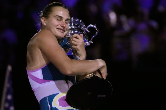 Aryna Sabalenka hugs the Daphne Akhurst Memorial Cup (Dita Alangkara/AP)