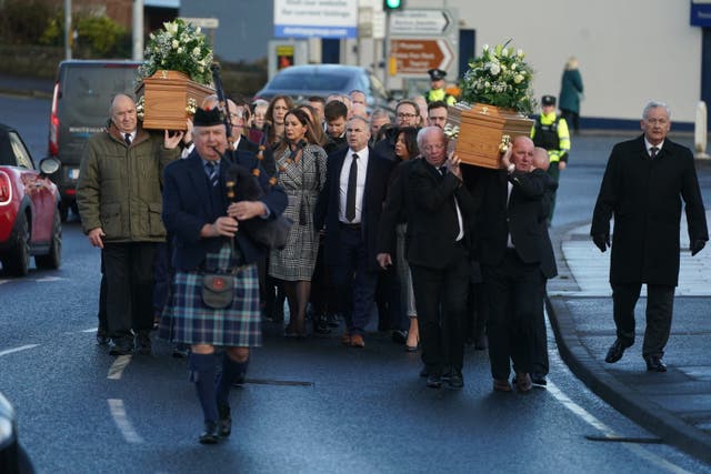 The coffins of Alex and Ann Easton arrive for the Service of Thanksgiving at Bangor Abbey (Brian Lawless/PA)