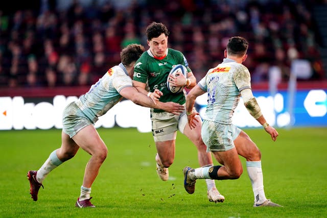 <p>London Irish's Henry Arundell (centre) is tackled</p>