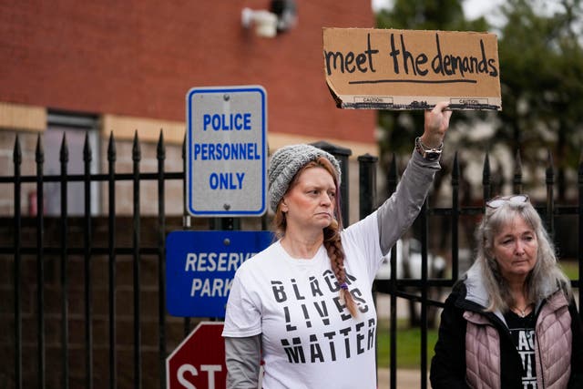 <p>A group of demonstrators protest outside a police precinct in response to the death of Tyre Nichols, who died after being beaten by Memphis police officers, in Memphis, Tenn., Sunday, 29 January 2023</p>