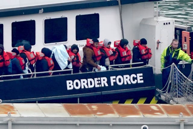 A group of people thought to be migrants being brought to Dover, Kent, on a Border Force vessel following a small boat incident in the Channel (PA)