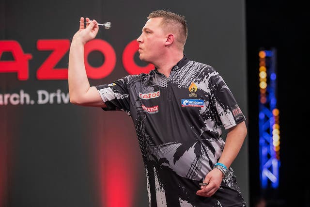 Chris Dobey won his first major PDC title when he beat Rob Cross in the Masters final in Milton Keynes (Taylor Lanning/PDC/PA)