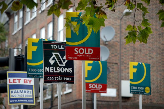 Letting and estate agents signs outside flats (Anthony Devlin/PA)