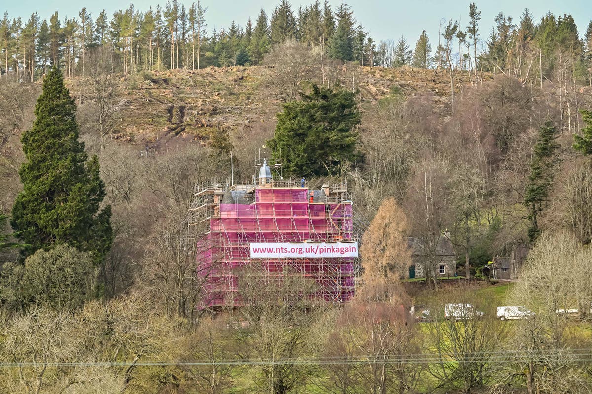 Castle swathed in seven-storeys of pink mesh for conservation work