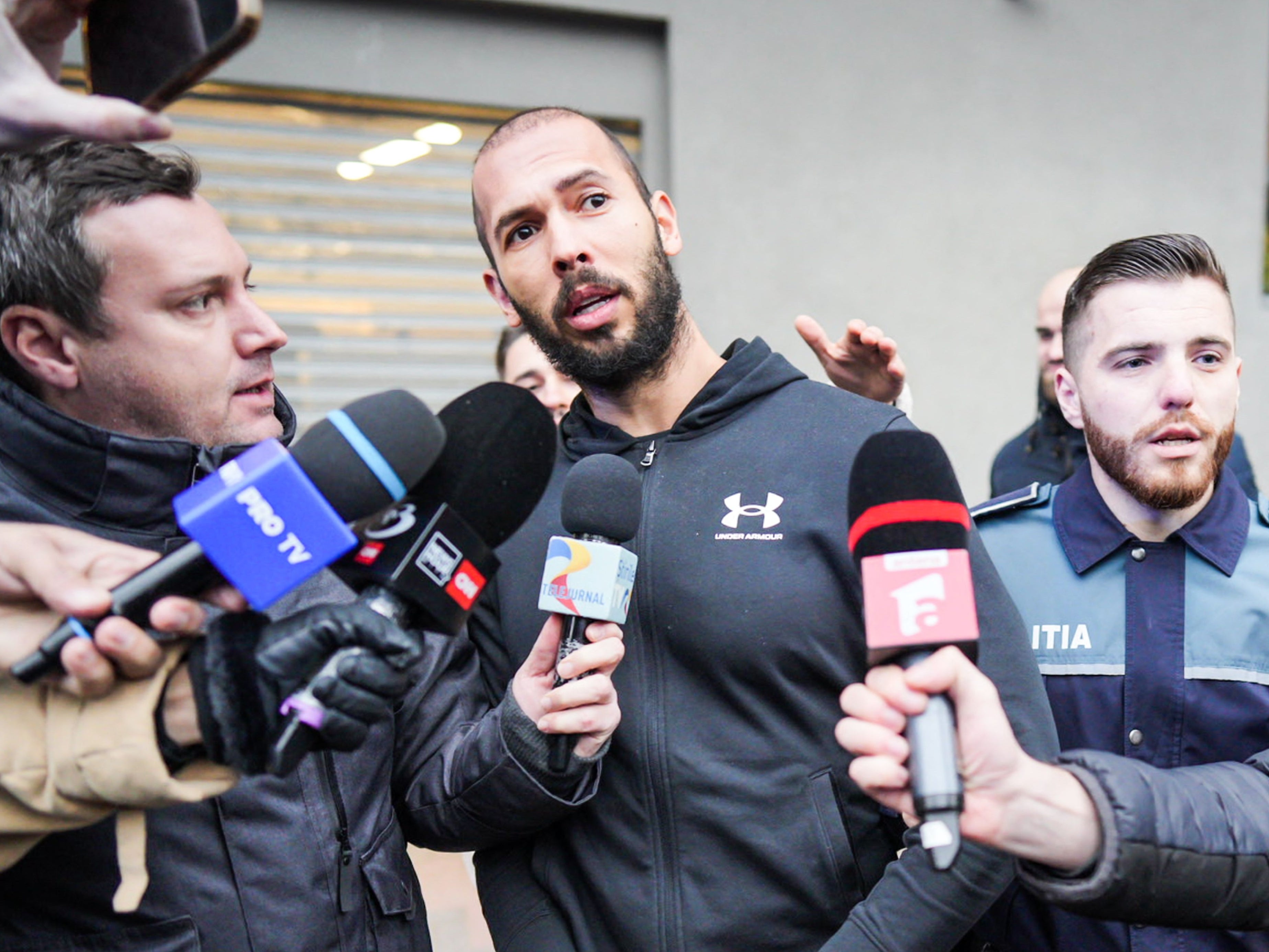 Tate speaks to reporters in Bucharest – he and his brother will be forced to stay in detention until late February