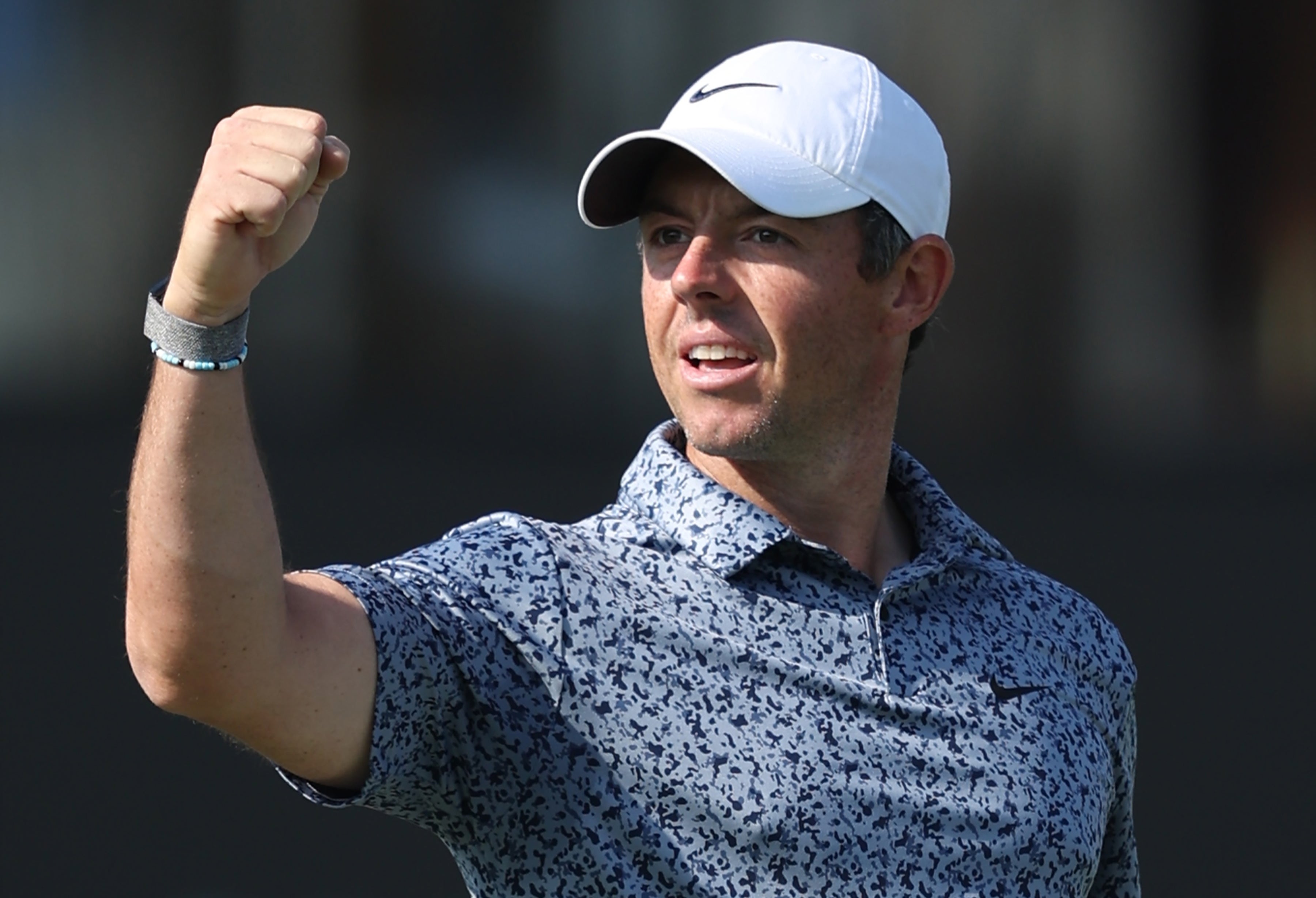 Rory McIlroy of Northern Ireland celebrates after winning the Hero Dubai Desert Classic 2023 Golf tournament