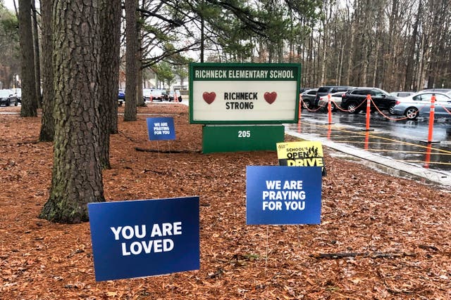 <p>Signs stand outside Richneck Elementary School in Newport News, Virginia, in support of teacher shot by six-year-old </p>