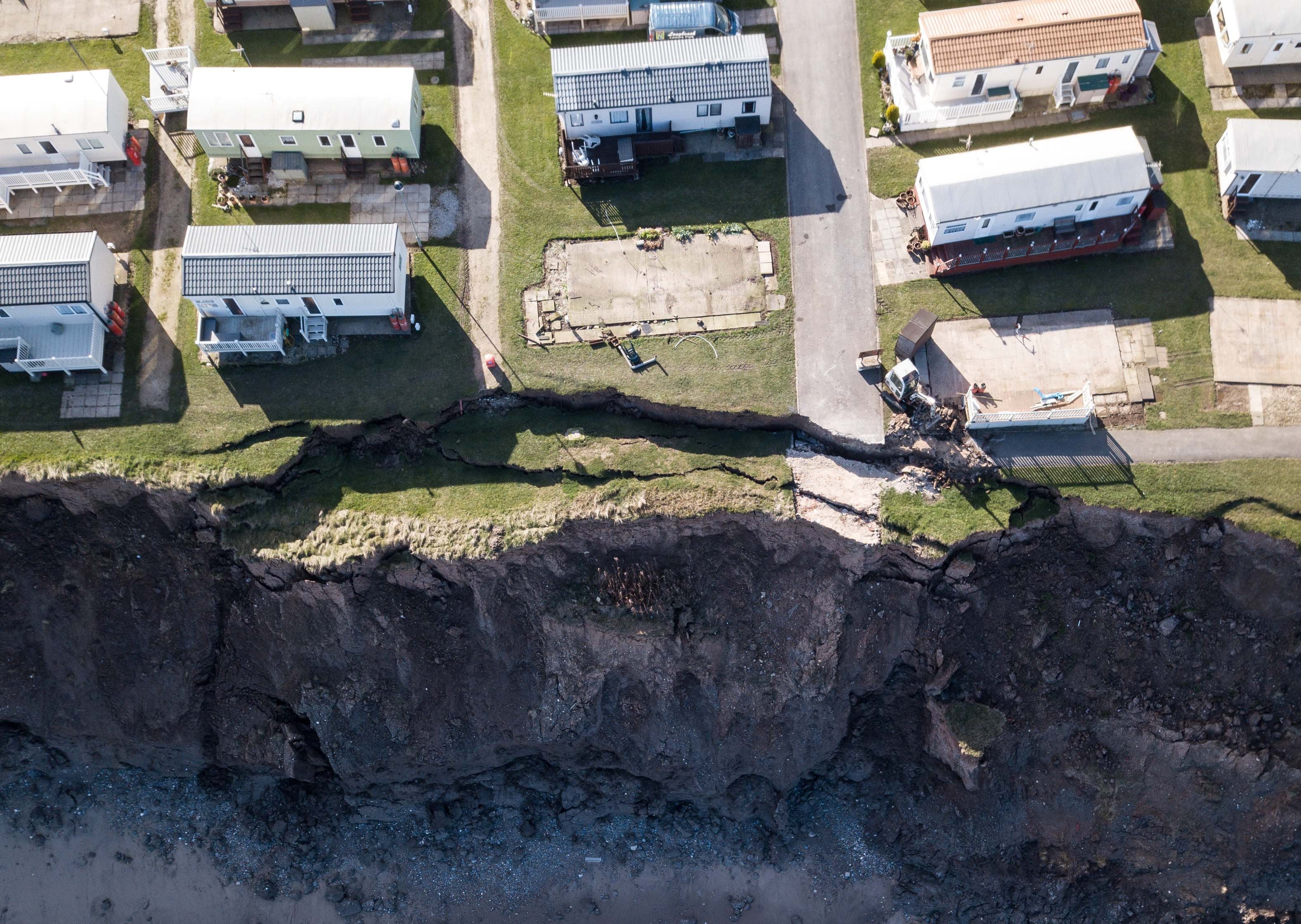 Drone photographs show the cliff erosion which has left homeowners in turmoil - as their properties edge closer to falling onto the beach in Longbeach Leisure Park, Hornsea