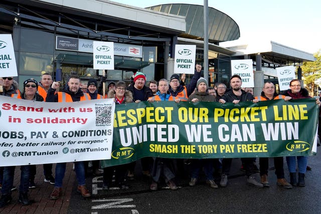 Train drivers in Aslef and the Rail, Maritime and Transport union (RMT) are embroiled in a long-running dispute over pay and conditions (Gareth Fuller/PA)