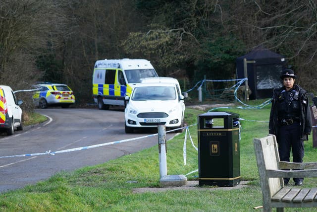 <p>Police at the scene of the fatal attack at Gravelly Hill in Caterham, Surrey </p>