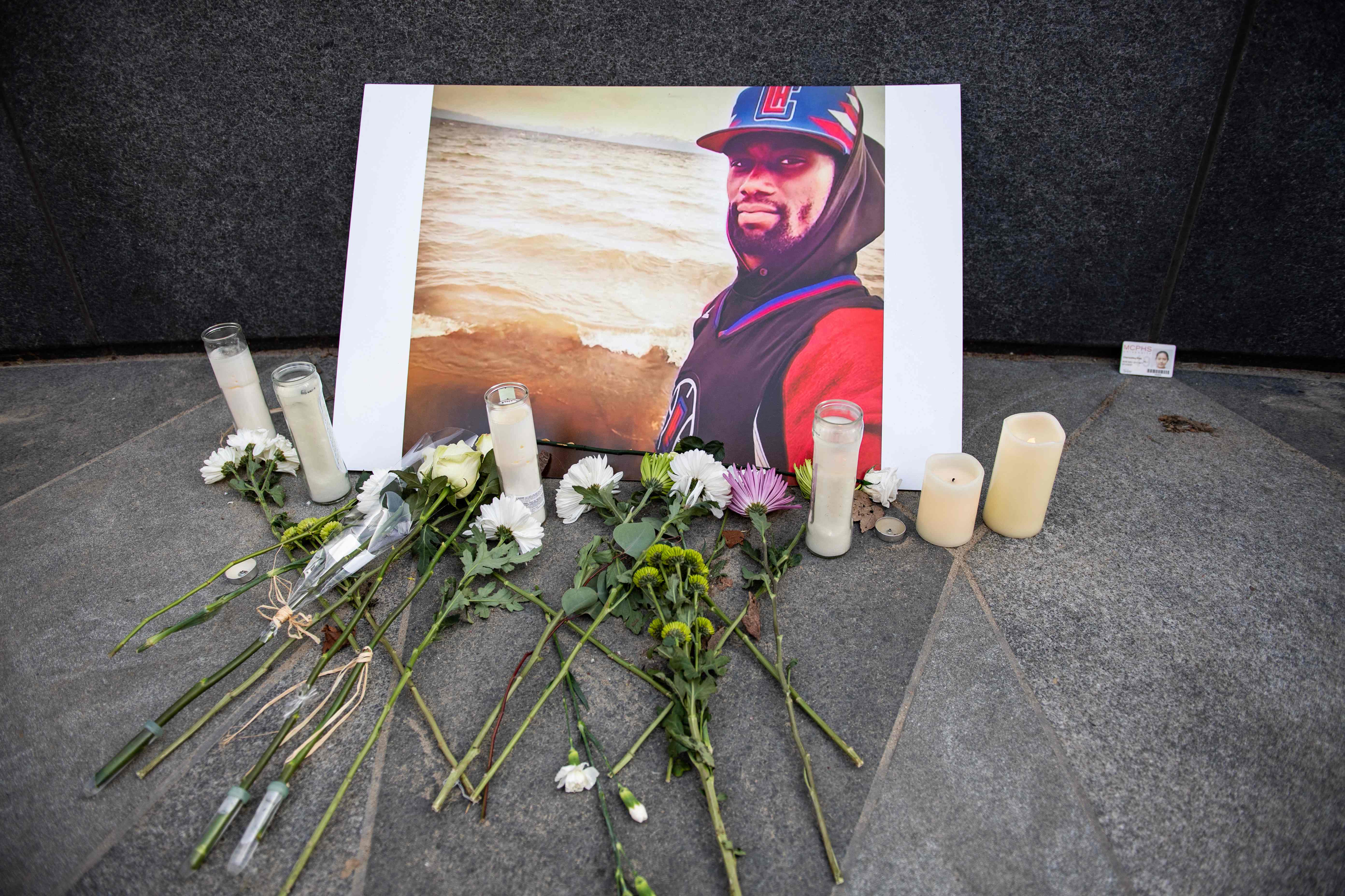 A memorial is displayed for Tyre Nichols at the Embrace statue in Boston, Massachusetts